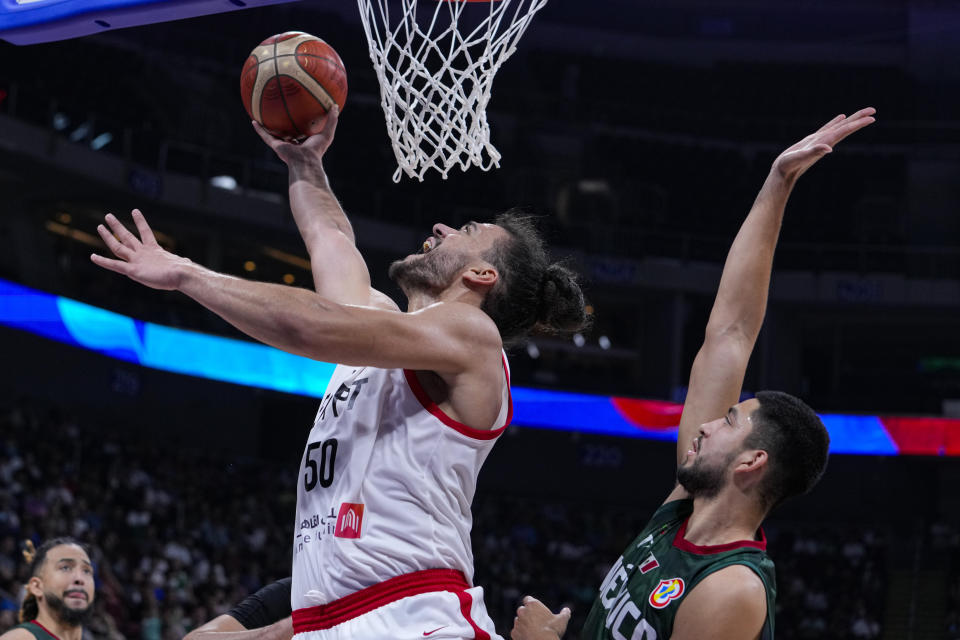 Egypt center Assem Marei (50) shoots in front of Mexico forward Gael Bonilla (2) during the second half of a Basketball World Cup group D match in Manila, Philippines Tuesday, Aug. 29, 2023.(AP Photo/Michael Conroy)