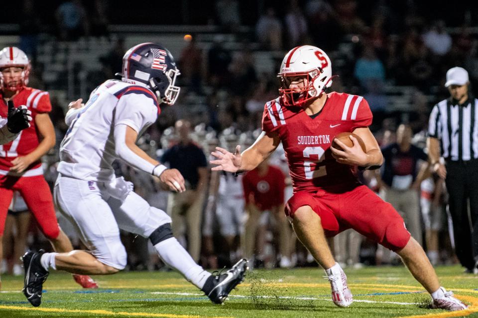 Souderton halfback Ryan Sadowski tries to elude Central Bucks East defensive back Dan Reinhardt.