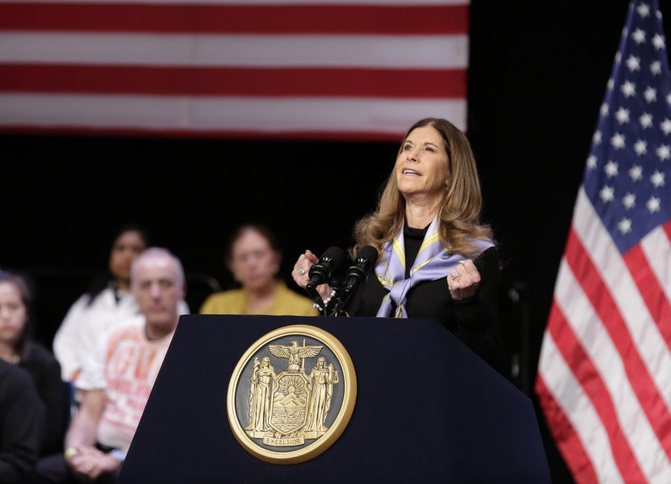 FILE - Linda Beigel Schulman, mother of Scott Beigel, who was killed in the Parkland school shooting, invokes his name while attending a bill signing ceremony in New York, Monday, Feb. 25, 2019. House Speaker Nancy Pelosi joined New York Governor Andrew Cuomo as he signed a "red flag" bill, which attempts to prevent people who present a threat to themselves or others from purchasing or owning a gun. (AP Photo/Seth Wenig, File)