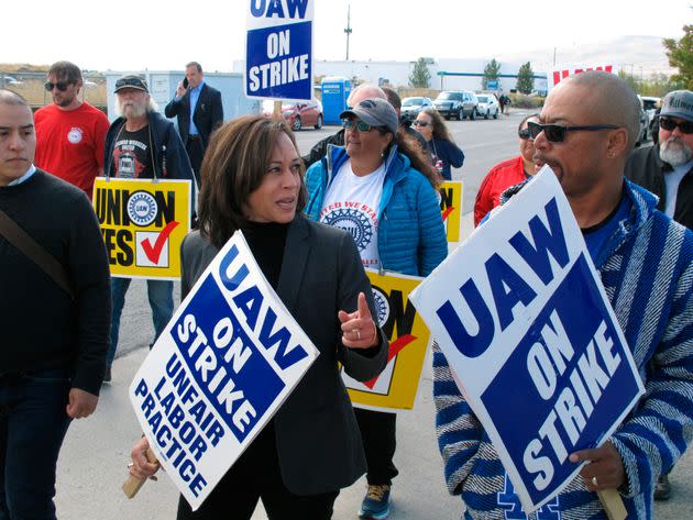 Then-Sen. Kamala Harris (D-Calif.) talks to a union leader while she walks a picket line with striking UAW members on Oct. 3, 2019, at a General Motors facility just north of Reno, Nevada.