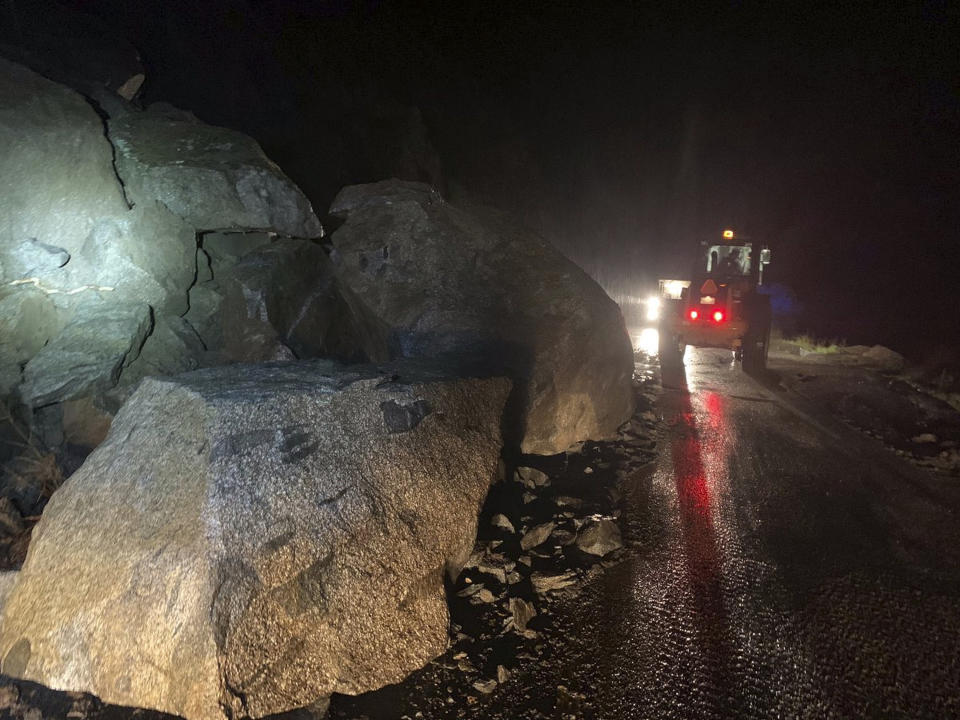 In this Tuesday, March 5, 2019 photo released by the The California Highway Patrol a road is closed due to multiple large boulders blocking California State Route 178 in the Canyon area in the mountains northeast of Bakersfield, Calif. Caltrans is estimating SR-178 will be closed for a couple days as boulders are still falling. CHP reported numerous incidents of roadway flooding in the mountains northeast of Bakersfield and in areas of the San Joaquin Valley, as well as in the Owens Valley at the foot of the Eastern Sierra and in Death Valley National Park. (California Highway Patrol via AP)