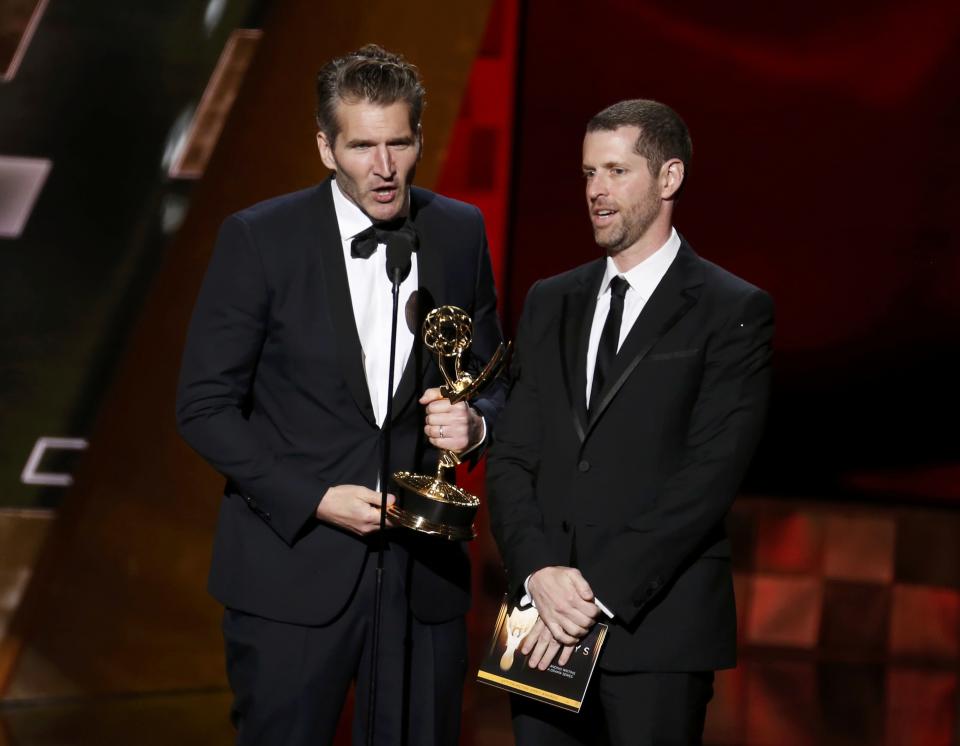 David Benioff, left, and D.B. Weiss accept the award for Outstanding Writing for a Drama Series for HBO’s <em>Game of Thrones</em> at the 67th Primetime Emmy Awards. (Photo: Reuters/Lucy Nicholson)