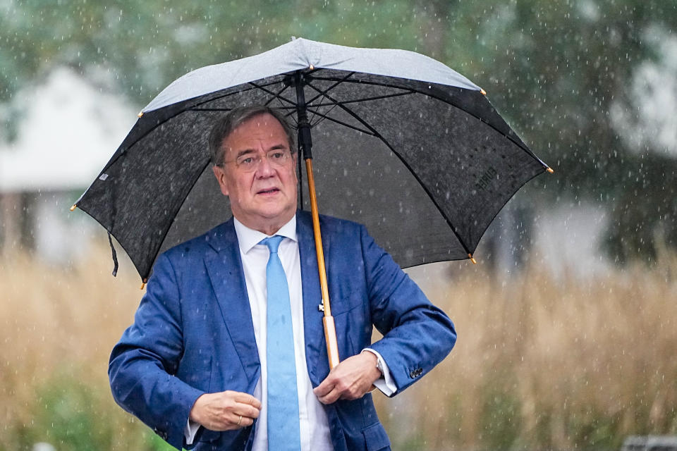 Armin Laschet chairman the Christian Democratic Union party arrives with a delegation from outgoing Chancellor Angela Merkel’s center-right Union bloc for exploratory talks with the Green party in Berlin, Germany, Tuesday, Oct. 5, 2021. German parties that hope for a share of power in Germany’s next government are wrapping up a first set of meetings to sound out each others’ positions and figure out who will try to form a coalition for a new government. (Michael Kappeler/dpa via AP)