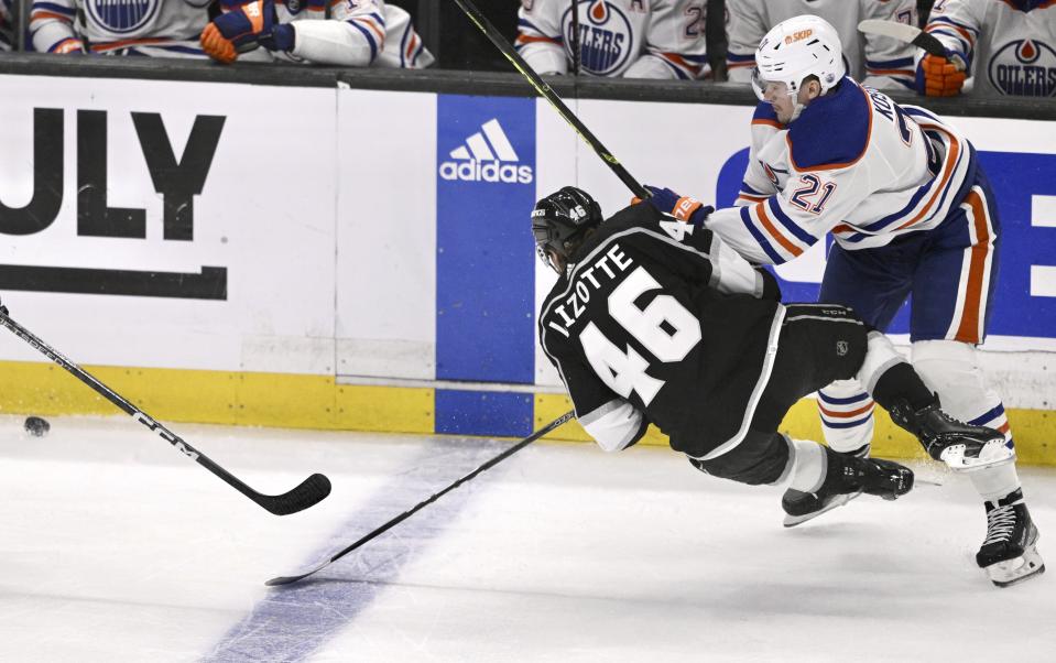 Los Angeles Kings' Blake Lizotte (46) is tripped by Edmonton Oilers' Klim Kostin during the first period in Game 6 of an NHL hockey Stanley Cup first-round playoff series in Los Angeles on Saturday, April 29, 2023. (Keith Birmingham