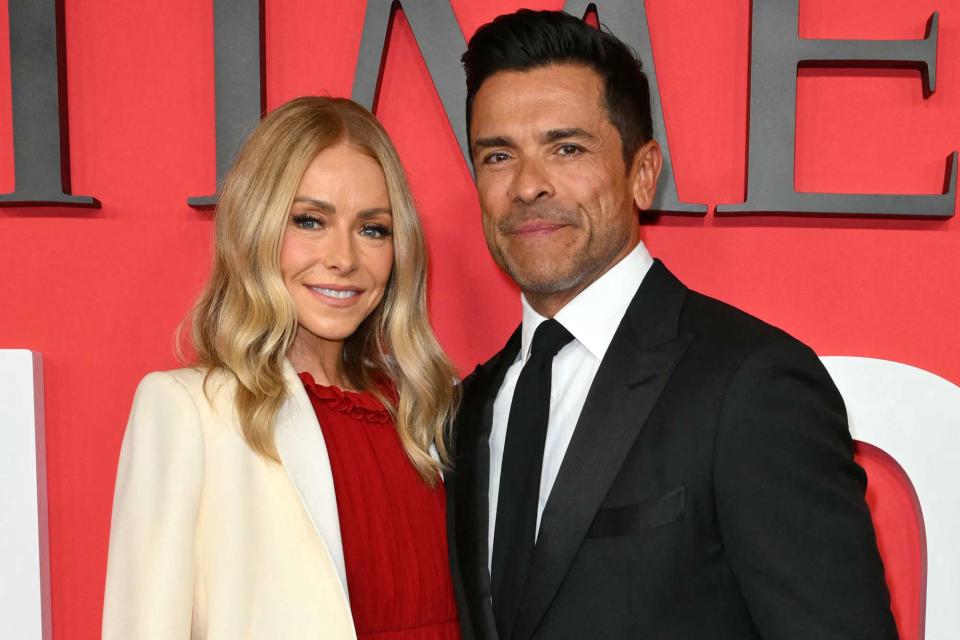 <p>ANGELA WEISS/AFP via Getty</p> Kelly Ripa and Mark Consuelos in New York City, on April 25, 2024.