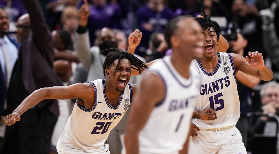 Ben Davis Giants Ramone Enis (20) and Ben Davis Giants Lincoln Murff (15) yells in excitement on Saturday, March 25, 2023 at Gainbridge Fieldhouse in Indianapolis. The Ben Davis Giants defeated the Kokomo Wildkats, 53-41, for the IHSAA Class 4A state finals championship. 