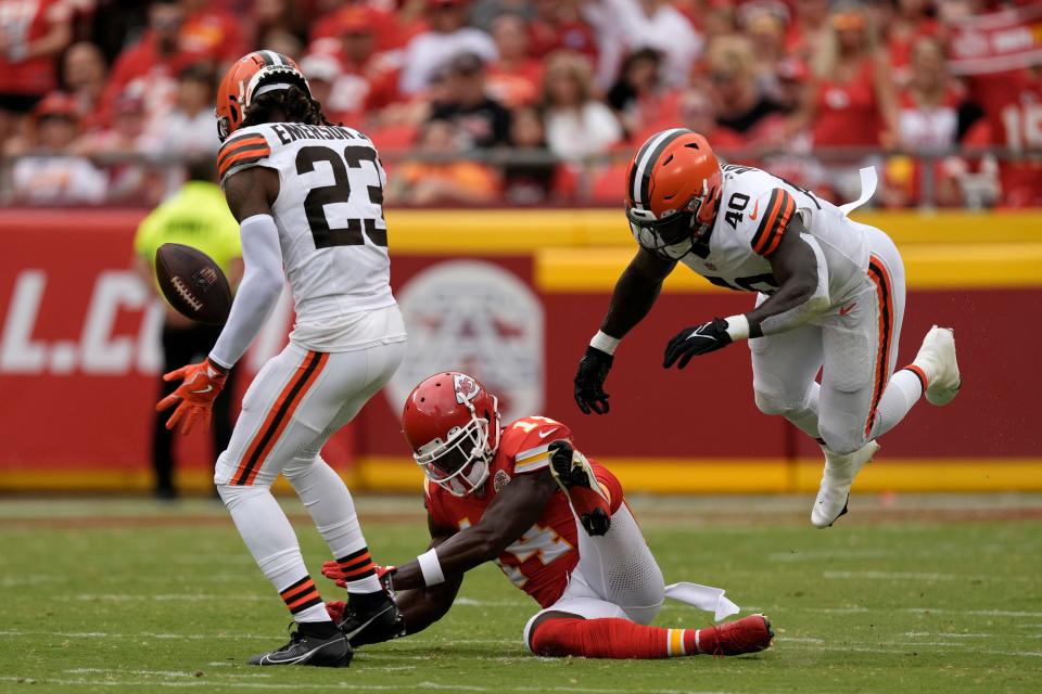 Browns cornerback Martin Emerson Jr. (23) and linebacker Matthew Adams (40) break up a pass intended for Chiefs wide receiver Cornell Powell (14) during the first half, Saturday, Aug. 26, 2023, in Kansas City, Mo.
