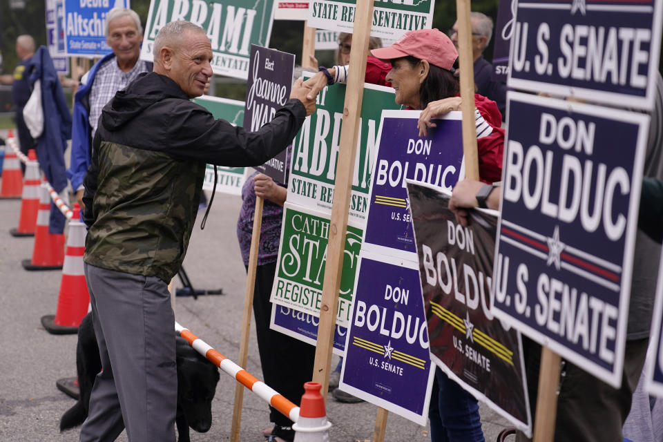 New Hampshire Republican U.S. Senate candidate Don Bolduc, shakes hands with campaign volunteers after voting, Tuesday, Sept. 13, 2022, in Stratham, N.H. (AP Photo/Charles Krupa)