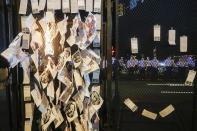 <p>Police stand guard away from burning fliers stuck into a police barricade near AT&T Station during a protest in Philadelphia, Tuesday, July 26, 2016, during the second day of the Democratic National Convention. (Photo: John Minchillo/AP)</p>