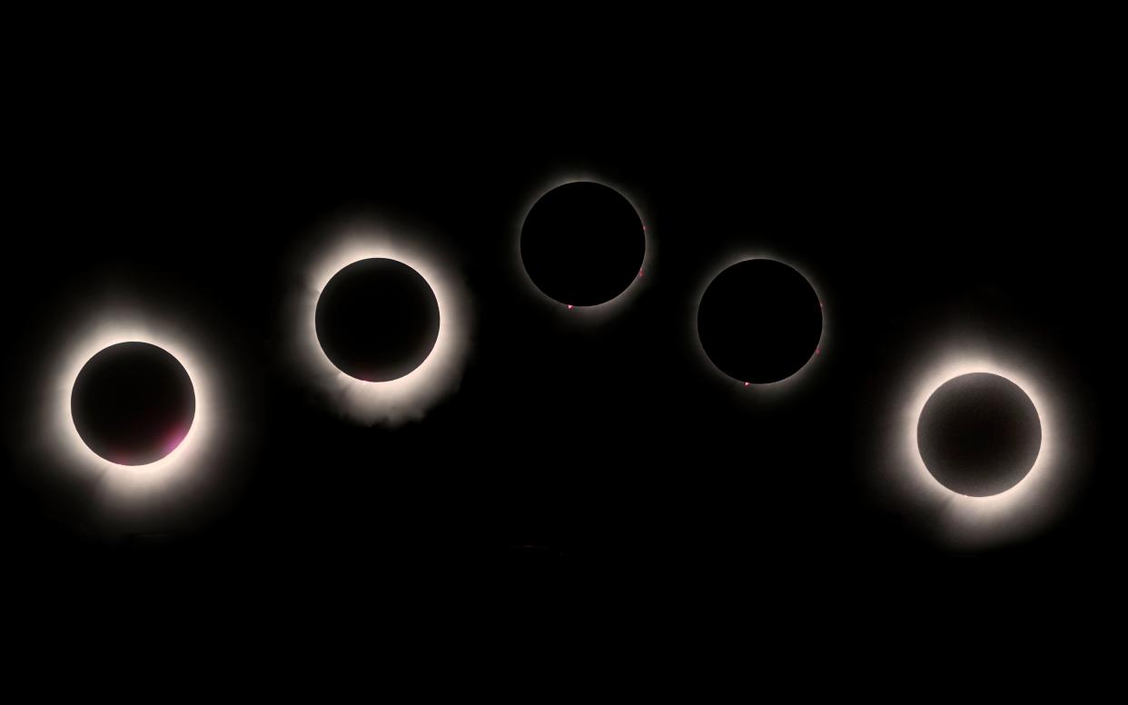 The progress of Monday's total solar eclipse is pictured in Findlay, Ohio, moving from right to left in this composite image.