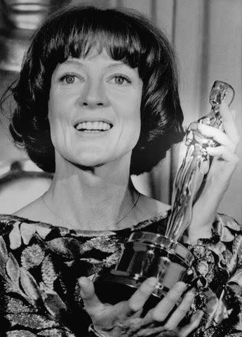 <p>Getty</p> Maggie Smith with her Oscar on April 9, 1979