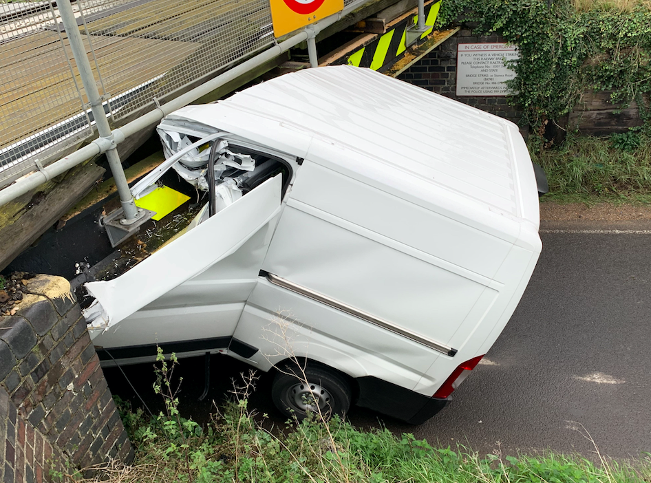 The van split right down the middle after becoming lodged underneath the structure (SWNS)