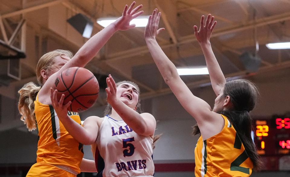 Indian Creek guard Lauren Foster (5) reaches for a lay-up against Greenwood Woodmen players on Thursday, Nov 17, 2022 at Edinburgh High School in Edinburgh. Indian Creek defeated the Greenwood Woodmen, 38-19. 