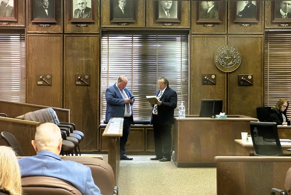 Jon Whitsit, left, assistant district attorney for the 46th District, discusses matters with former Sheriff Jeffrey Lyde's lead defense counsel, Bob Estrada of Wichita Falls, right, Oct. 10, 2023, at the Montague County Courthouse.