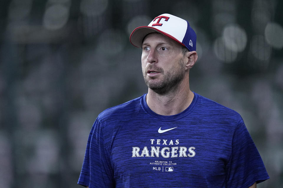 Texas Rangers starting pitcher Max Scherzer takes the field for a workout before a baseball game against the Houston Astros Sunday, April 14, 2024, in Houston. (AP Photo/Kevin M. Cox)