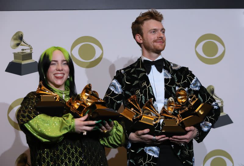 62nd Grammy Awards – Photo Room – Los Angeles, California, U.S., January 26, 2020 - Billie Eilish and Finneas O'Connell pose backstage with her awards