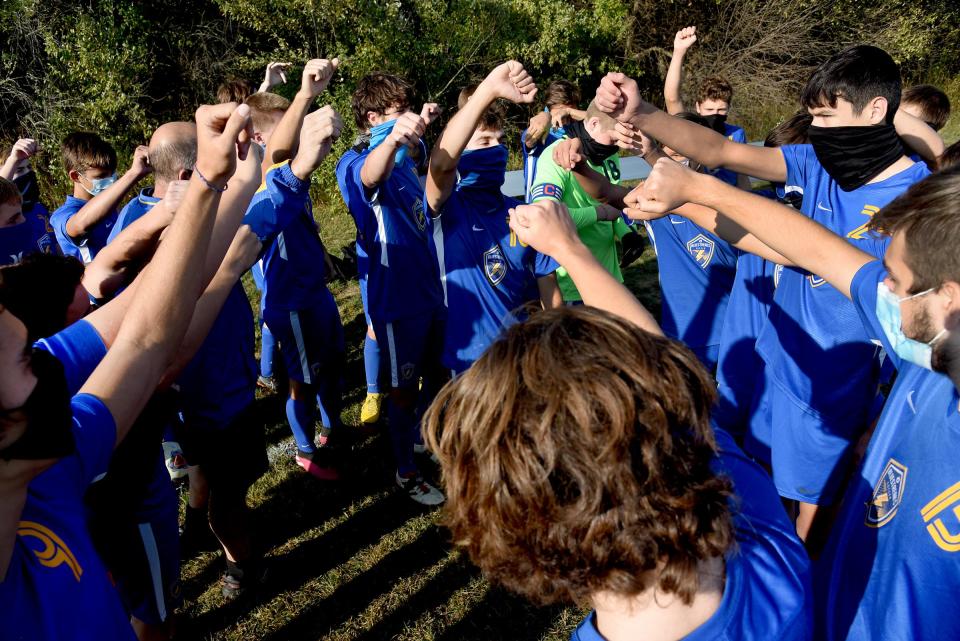 Ida boys soccer team get fired up before a game last season against Clinton.