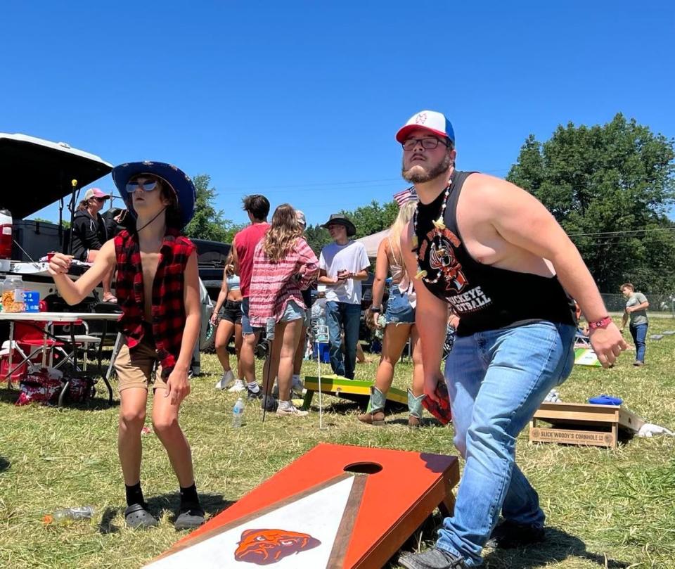 Country Fest fans play cornhole in the parking lot prior to Saturday's music, which featured HARDY and Morgan Wallen. Saturday was the last day of the event at Clay's Resort Jellystone Park in Stark County.