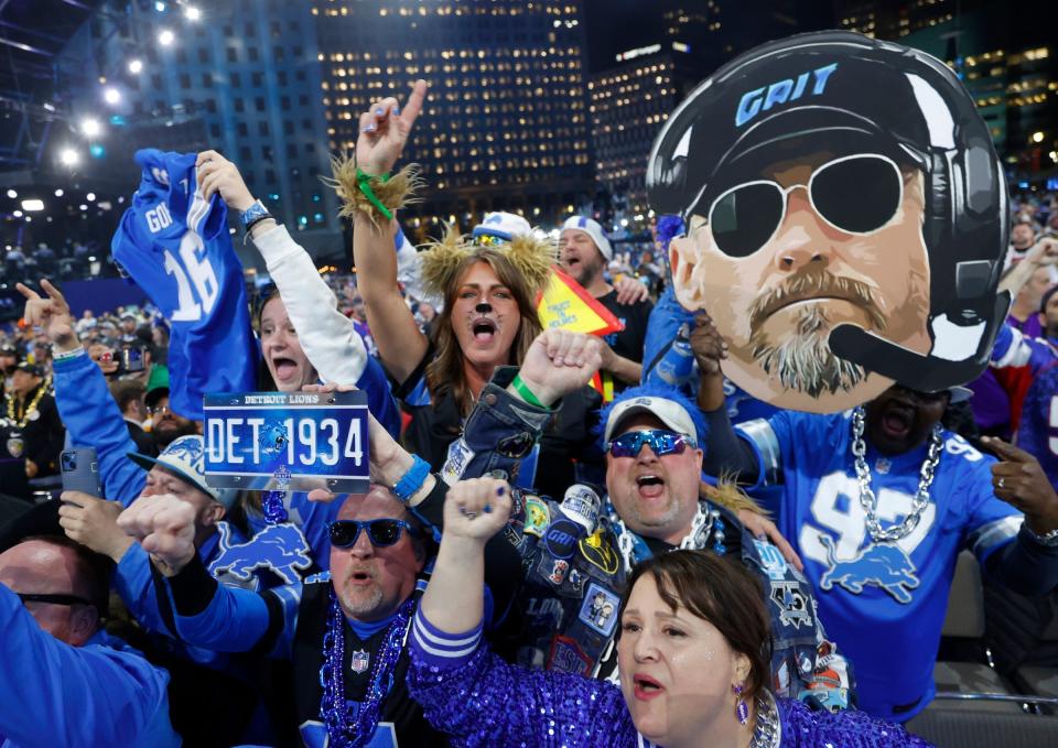 Lions fans celebrate during the draft.