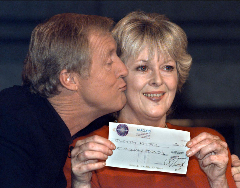 Who Wants to Be A Millionaire winner Judith Keppel (right) receiving a kiss from Chris Tarrant at a photo call at Elstree studios in London. She has become the first contestant to scoop the  1million jackpot on the hit quiz show Who Wants To Be A Millionaire?  *... Viewers have already seen Mrs Keppel - who is a relative of Camilla Parker Bowles, the partner of the Prince of Wales - win  16,000. But later, a show insider confirmed, the garden designer, who used up her Ask The Audience lifeline when she was stumped by the question asking her in which country was Prime Minister Tony Blair born, will go all the way to  1 million.   (Photo by Peter Jordan - PA Images/PA Images via Getty Images)