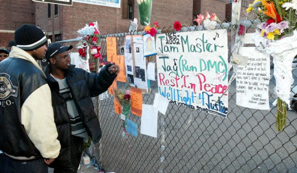 Fans mourn Run-DMC member DJ Jam Master Jay in Queens, N.Y., after he was shot and killed. (Photo: Matt Campbell/Getty Images)