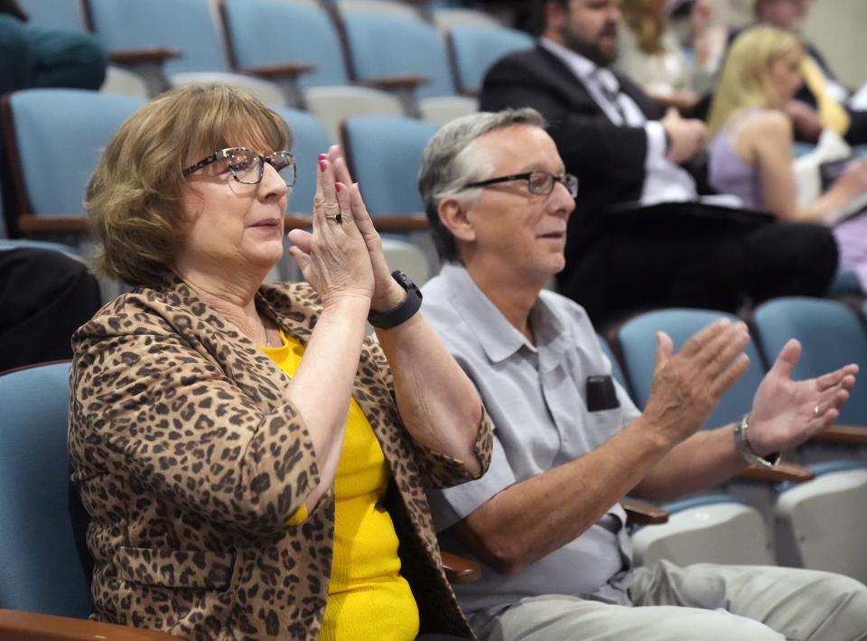 Cathy McDavid and her husband, Mike Mazur, react as they watch the voting on House Bill 2764, a long-awaited assisted living care bill, on April 4, 2024. Members of the House voted to pass the bill to the Governor's Office.