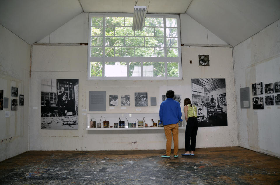 Visitors tour the art studio where American Abstract Expressionist artist Jackson Pollock created his action paintings in 1945 until his death in 1956, at the Pollock-Krasner House and Study Center, Saturday, Sept. 17, 2022, in The Springs, a hamlet in East Hampton, N.Y. Pollock and his wife, artist Lee Krasner, married in 1945 and moved to the house and converted the barn into an art studio. (AP Photo/Pamela Hassell)