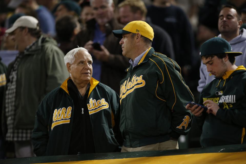 A changing of the guard within the A's ownership: Lew Wolff (left) is out as managing partner and John Fisher (right) is in. (Getty Images)