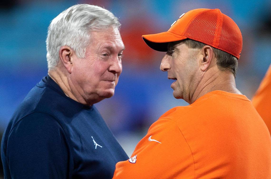 North Carolina coach Mack Brown talks with Clemson coach Dabo Swinney prior to the ACC Championship game on Saturday, December 3, 2022 at Bank of American Stadium in Charlotte, N.C.