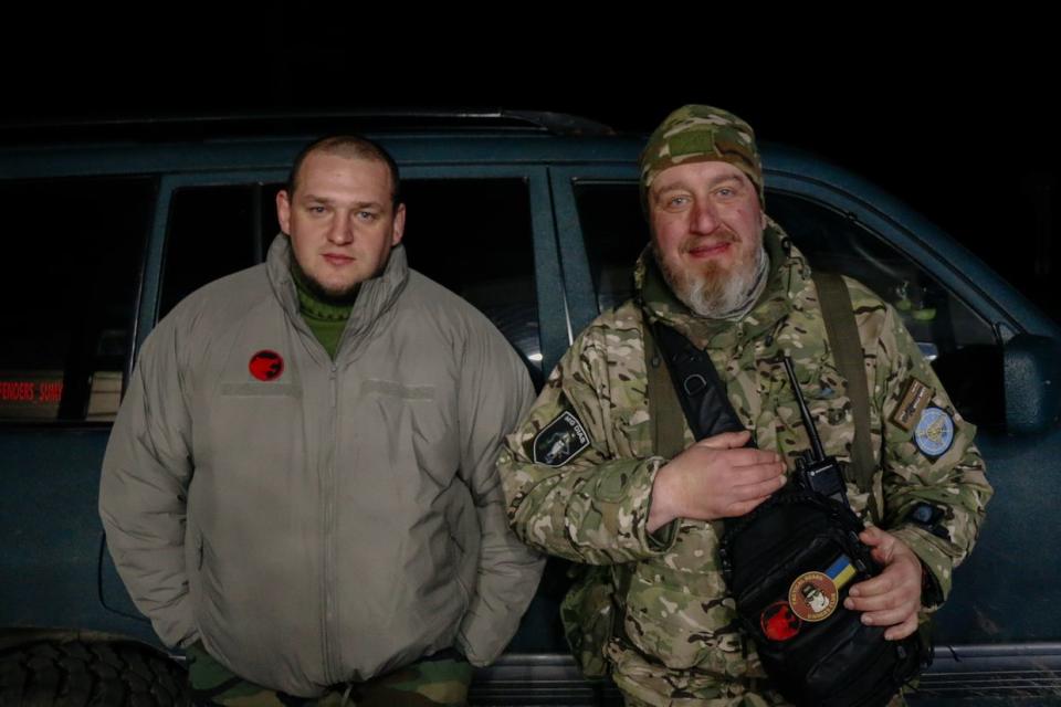 Call sing Ranger (L), a soldier within Ukraine's 117th Territorial Defense Brigade, stands alongside his squad leader, call sign Dias (R), after a night shift hunting Shahed loitering munitions and reconnaissance drones in Sumy Oblast, Ukra in late March 2024. (Alexander Khrebet / The Kyiv Independent)