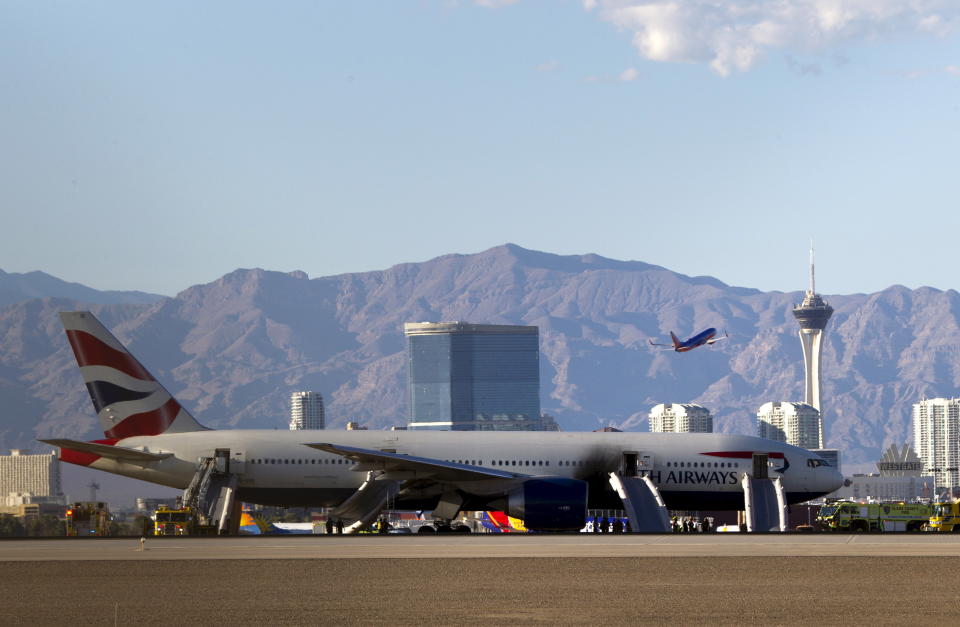 A British Airways passenger jet is shown after a fire at McCarran International Airport in Las Vegas September 8, 2015. The plane caught fire after an aborted takeoff on Tuesday, but the flames were extinguished and just two people among the 159 passengers and 13 crew onboard suffered minor injuries, McCarran International Airport said on Twitter. REUTERS/Steve Marcus      TPX IMAGES OF THE DAY     