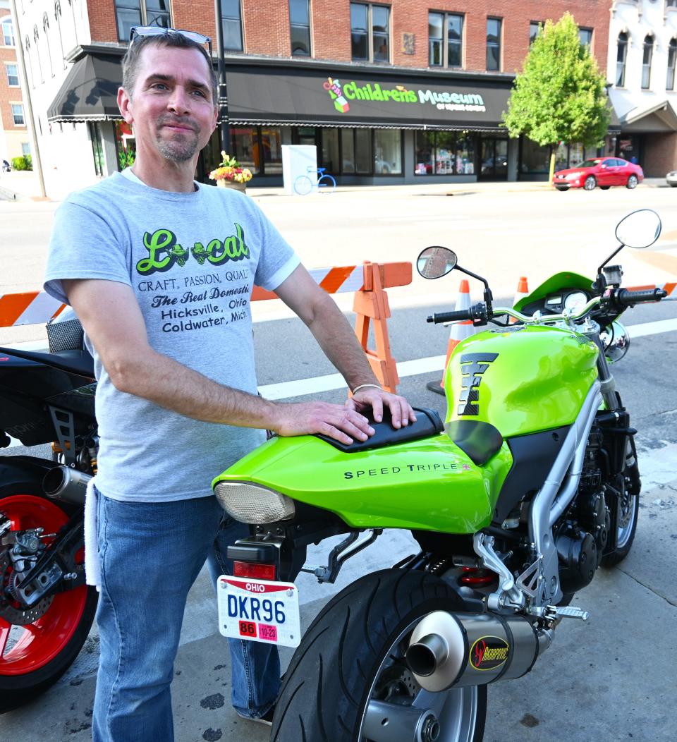 Two Bandits Brewery owner Mark Young rode his Triumph as did his wife from Bryan, Ohio, for the first Petrol N' Pints street party.