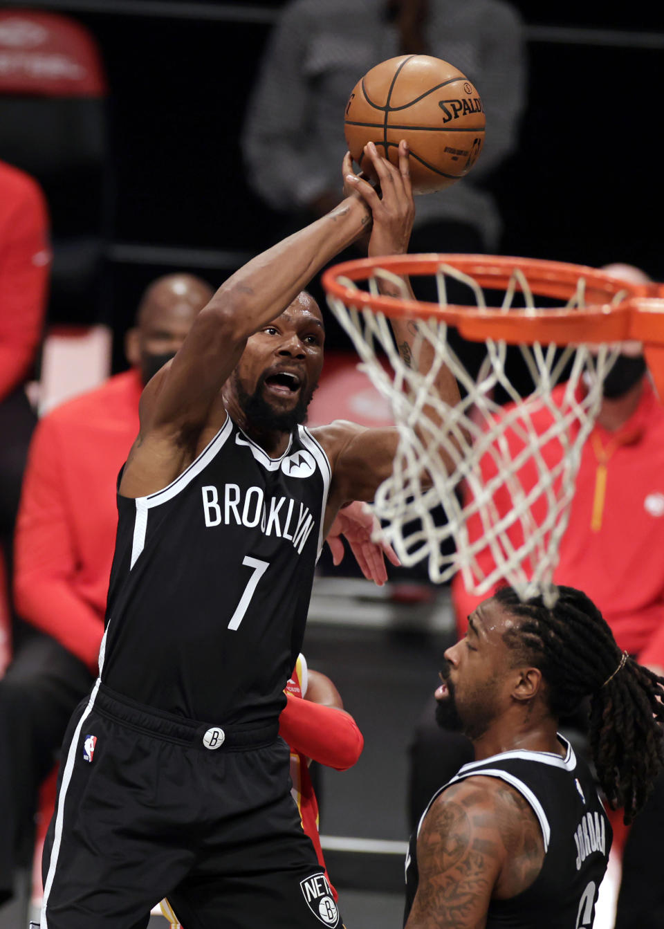 Brooklyn Nets forward Kevin Durant (7) shoots against the Atlanta Hawks during the second half of an NBA basketball game Friday, Jan. 1, 2021, in New York. (AP Photo/Adam Hunger)