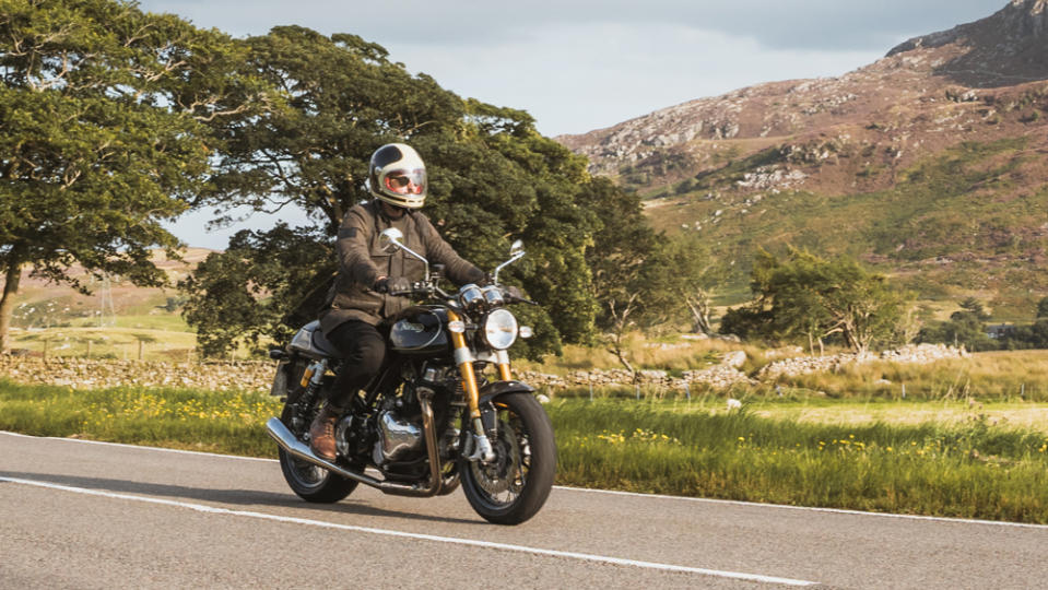 Riding the Norton Commando motorcycle.