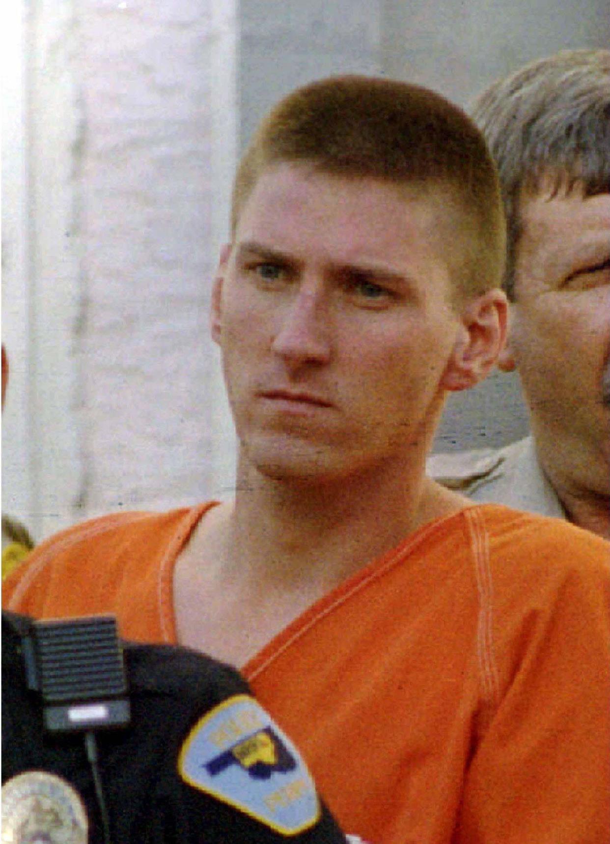 Oklahoma City bomber Timothy McVeigh is shown being escorted from the Noble County Courthouse as he is transported to Oklahoma City for arraignment in this April 22, 1995 file photo.