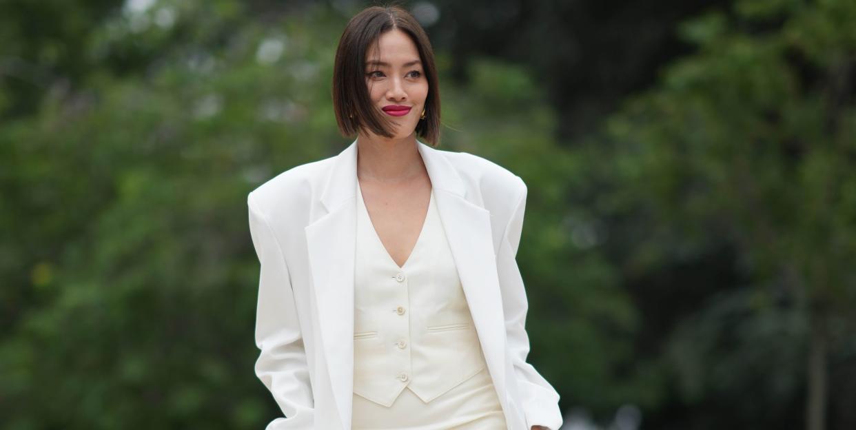 a fashion expert at paris haute couture week to illustrate a guide to the best suit vests for women for 2023