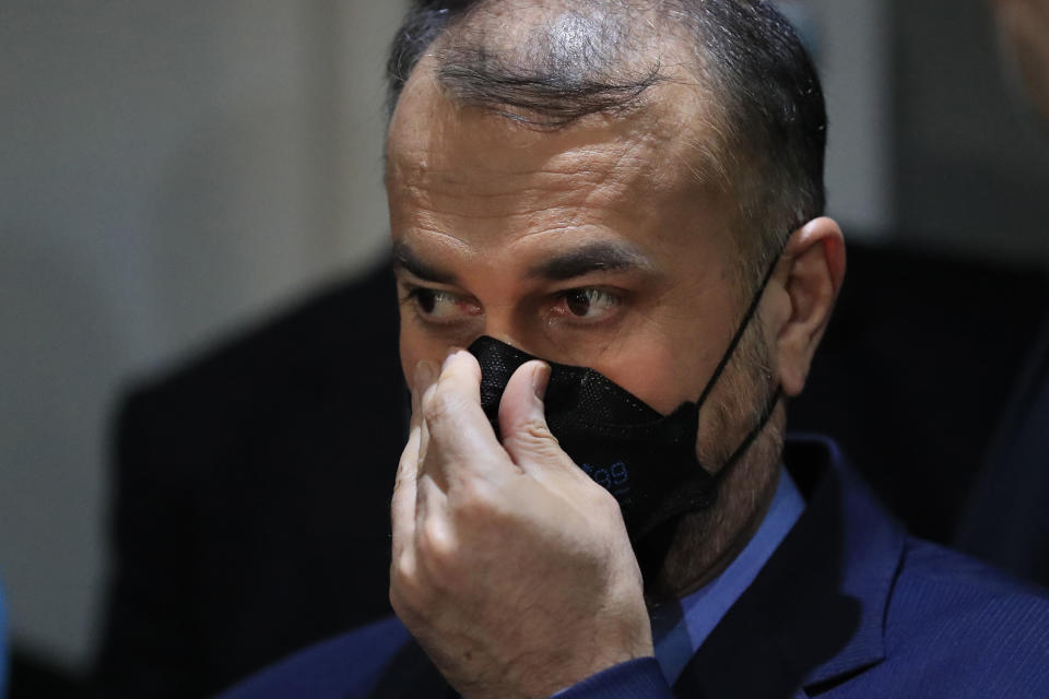 Iranian Foreign Minister Hossein Amirabdollahian, adjusts his mask as he speaks during a joint press conference with his Lebanese counterpart Abdullah Bou Habib, in Beirut, Lebanon, Thursday, Oct. 7, 2021. Amirabdollahian said he discussed with officials in Beirut the "positive" effects of ongoing talks between Iran and Saudi Arabia, and blamed foreign troops based in the Middle East for regional instability. (AP Photo/Hussein Malla)