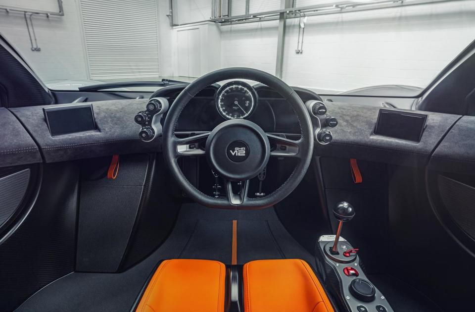 <p>Like the F1, the T.50's interior is all about the driver's experience. The main seat sits squarely in the middle of the car, with two passenger seats on either flank. There's a central rpm dial paired to a screen for infotainment. </p>