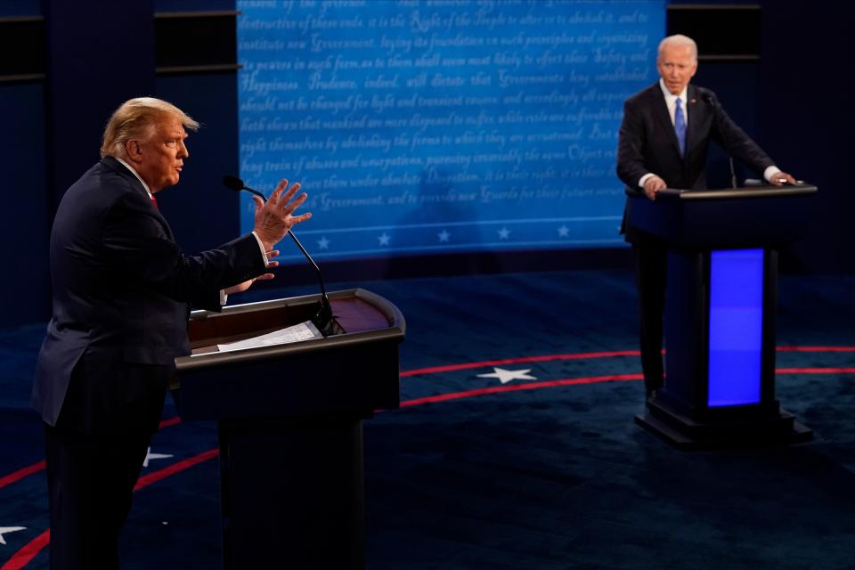 President Donald Trump answers a question as Democratic presidential candidate former Vice President Joe Biden listens during the second and final presidential debate at Belmont University on Oct. 22. (Pool via Getty Images)