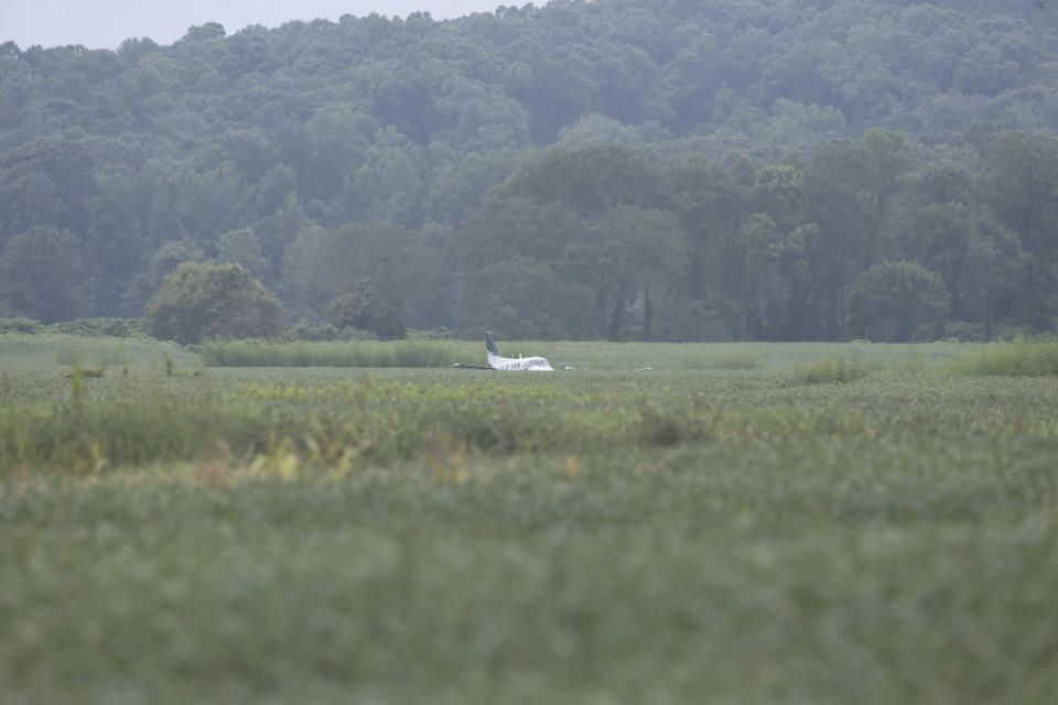 A stolen Beechcraft King Air C90A rests in a soybean field following its crash landing near the Gravestown Volunteer Fire Department along Highway 4 West near Ripley, Miss., on Saturday, Sept. 3, 2022. (Thomas Wells/The Northeast Mississippi Daily Journal via AP)