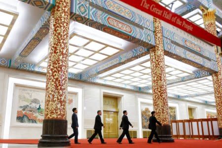 Communist Party spokesman Tuo Zhen and other officials arrive at a media briefing one day ahead of the opening of the 19th National Congress of the Communist Party of China, at the Great Hall of the People in Beijing, China October 17, 2017.  REUTERS/Thomas Peter