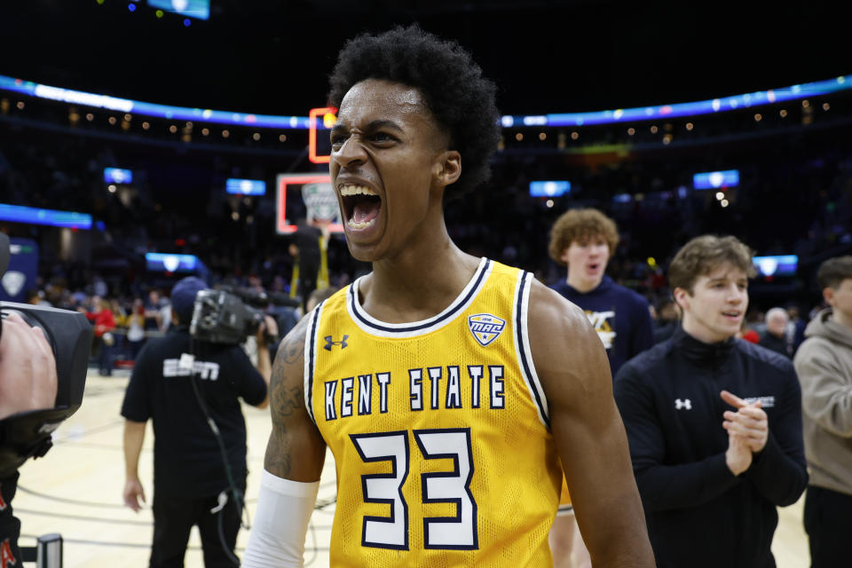 Kent State forward Miryne Thomas celebrates after defeating Toledo in an NCAA college basketball game to win the championship of the Mid-American Conference Tournament, Saturday, March 11, 2023, in Cleveland. (AP Photo/Ron Schwane)