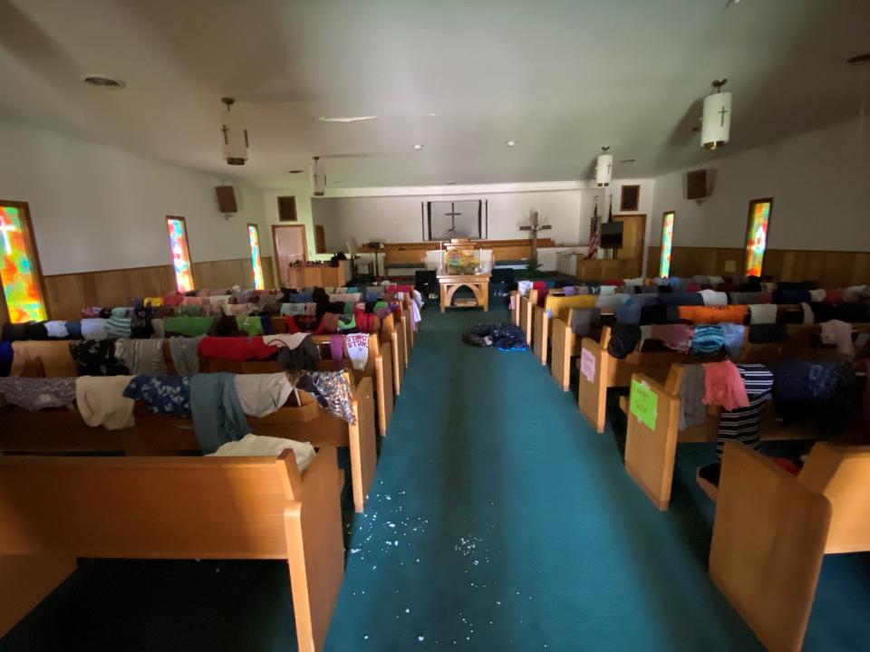 Despite a lack of electricity, the sanctuary of Deer Creek Baptist Church is serving as part of a "free general store" for people who need clothes or just about anything else.