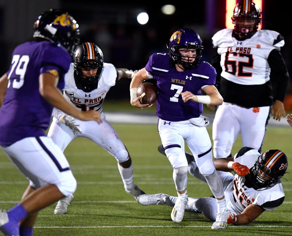 Wylie quarterback Kadin Long scrambles past the El Paso defense during last week's Class 5A Division II first-round playoff game at Sandifer Stadium.