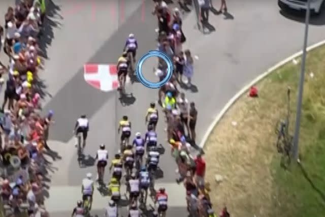 <p>NBC Sports/YouTube</p> A spectator taking a selfie on the sidelines of the Tour de France made contact with rider Sepp Kuss' bike.