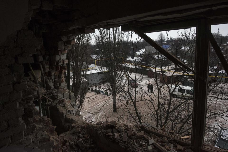 A view of a street from a flat in an apartment building damaged by shelling in Avdiivka, Ukraine, Saturday, Feb. 4, 2017. Fighting in eastern Ukraine sharply escalated this week. The Ukrainian command said Saturday that several soldiers were killed in the past day. (AP Photo/Evgeniy Maloletka)