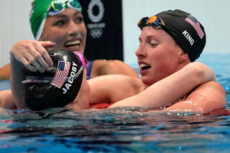 Lilly King, right, bronze medalist in the 100-meter beast stroke at the 2020 Olympics.