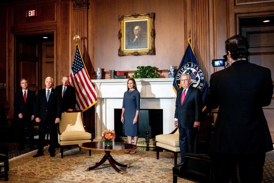 Judge Amy Coney Barrett meets with Vice President Mike Pence and Senate Majority Leader Mitch McConnell in the Capitol in Washington on September 29, 2020. / Credit: SUSAN WALSH/POOL/AFP via Getty Images