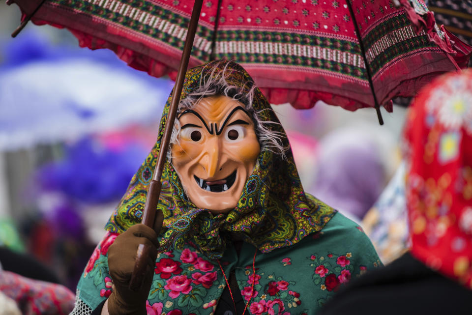 <p>A participant dressed as a witch enjoys the carnival parade in Wuerzburg, southern Germany, Feb. 11, 2018. (Photo: Nicolas Armer/dpa via AP) </p>