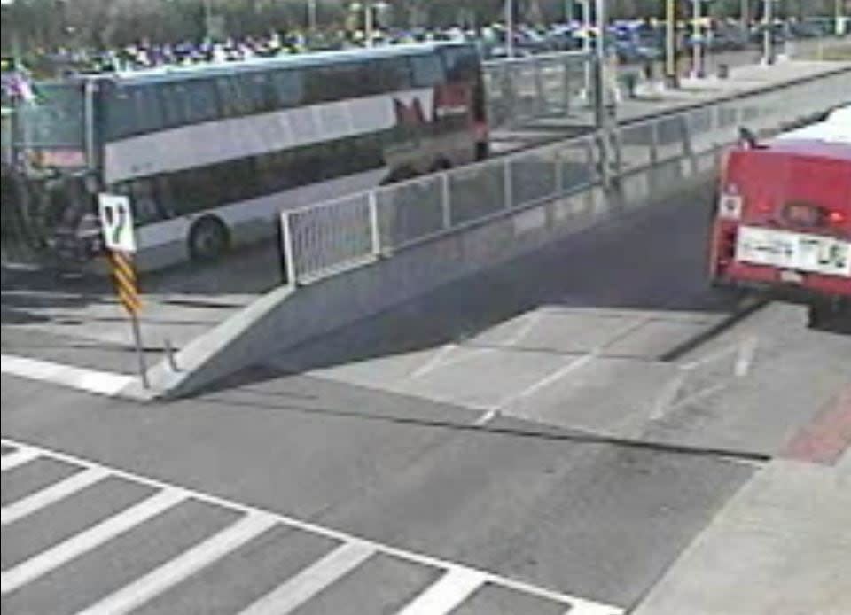 A still from one of the CCTV videos obtained by CBC News, showing OC Transpo bus 8017 as it pulls away from Fallowfield transit station on Sept. 18, 2013, moments before it collided with a train at a level crossing, killing six.